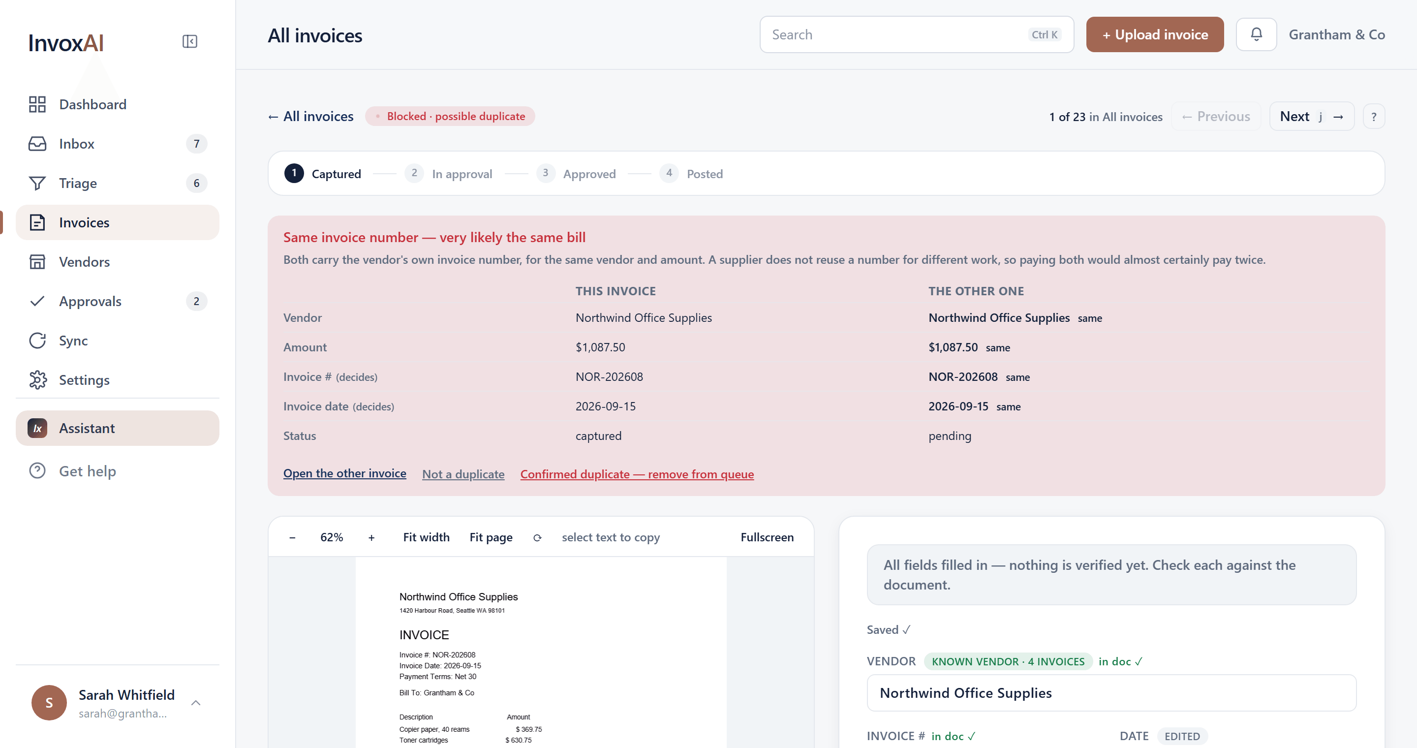 InvoxAI holding an invoice back as a possible duplicate, with this invoice and the other one side by side — same vendor, same $1,362.14, same invoice number, same date — above the choice to open the other, dismiss it, or confirm the duplicate.